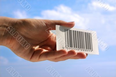 hand holding business card with fake bar code