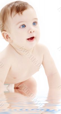 portrait of crawling baby boy looking up