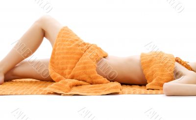 torso of relaxed lady with orange towels