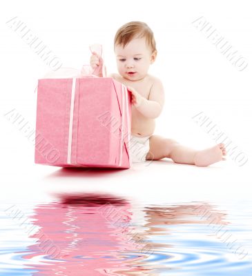 baby boy in diaper with big gift box