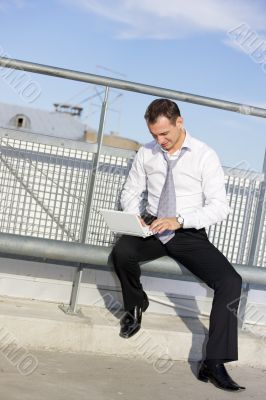 handsome businessman with laptop