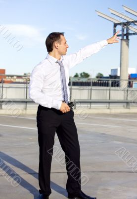 businessman in a front of a building site businessman in a front of a building site