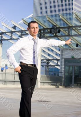 businessman in a front of a building site