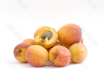 Fresh appetizing apricots on a white background