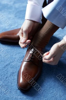 Businessman dressing for work