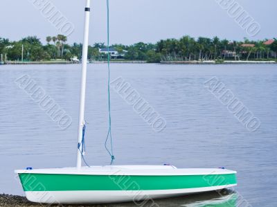 Sail boat on the shore