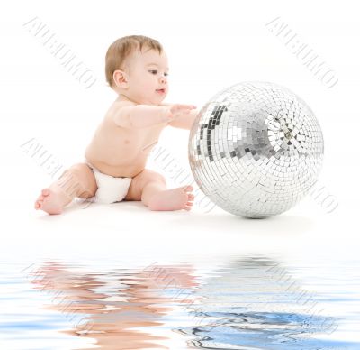 adorable baby boy with big disco ball