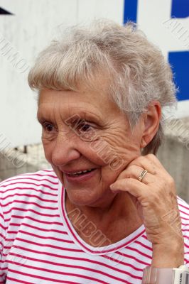 A cheerful smiling grandmother. A cheerful smiling grandmother.