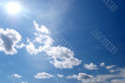 day blue sky with white fluffy clouds