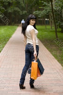 brunet girl with shopping bags