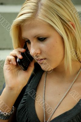 Young, blonde girl with a mobile phone. Young, blonde girl with a mobile phone.