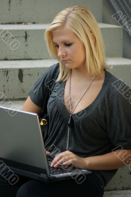 Young, blonde girl with laptop. Young, blonde girl with laptop.