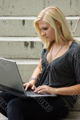 Young, blonde girl with laptop. Young, blonde girl with laptop.