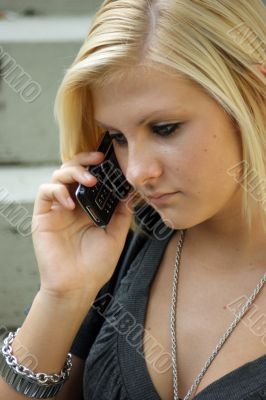 Young, blonde girl with a mobile phone. Young, blonde girl with a mobile phone.