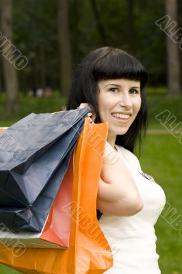  girl holding in hands bags