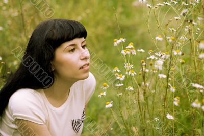 girl relaxing on a meadow