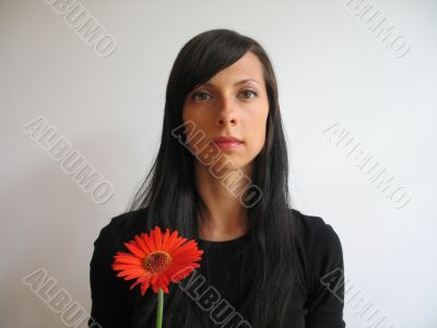dark hair girl with a flower