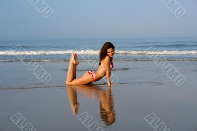 Beautiful girl on the ocean beach