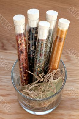spices in a glass on wood table