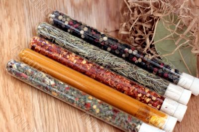 spices in a glass on wood table