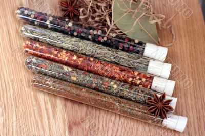 spices in a glass on wood table
