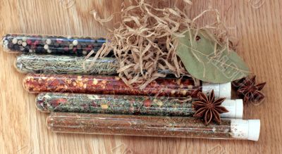 spices in a glass on wood table