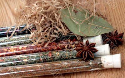 spices in a glass on wood table
