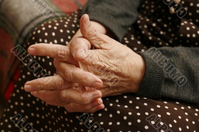 Hands of the elderly woman