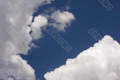 Puffy Clouds on a blue sky.