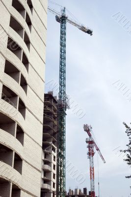 Building tower crane on the sky background