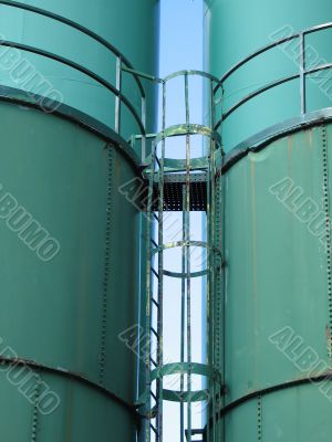 giant green containers, silos