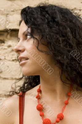 brunette on brick wall background