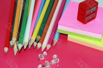 crayons, sticky notes drawing-pins and steel