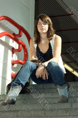 Young girls, young woman sitting on a staircase. Young girls, young woman sitting on a staircase.