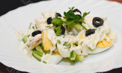 Salad of boiled eggs, cucumbers and olives