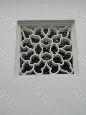 white design in front of a window