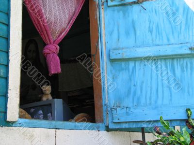 blue opened window with pink curtains