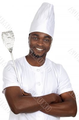 African handsome cook with kitchen utensils