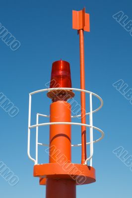 photo of small lighthouse on the daytime