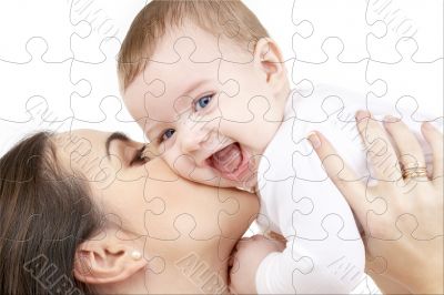 laughing baby playing with mother puzzle