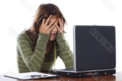 Beautiful frightened girl with laptop