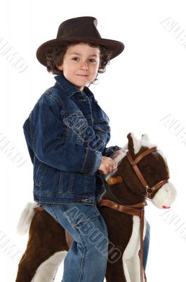 Child mounted on a wooden horse