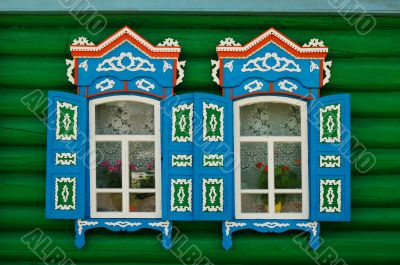 Two open windows of Russian village house
