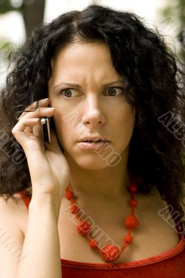 woman on phone getting bad news