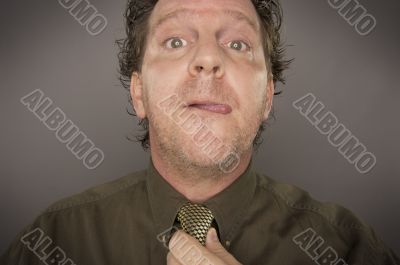 Man Concentrating Fixing Tie