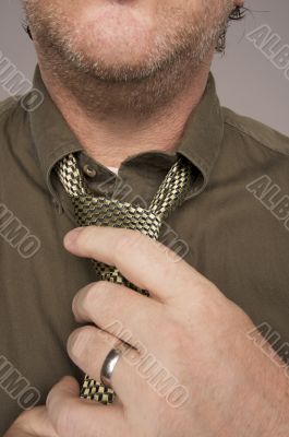 Man Fixing Tie