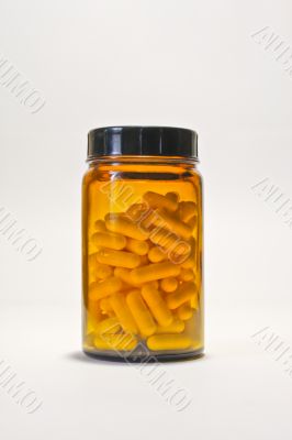 bottle with yellow pills