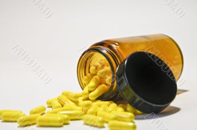 bottle with yellow pills
