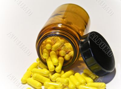 medicine box with yellow pills