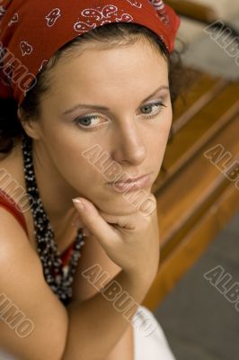 unhappy woman in red kerchief